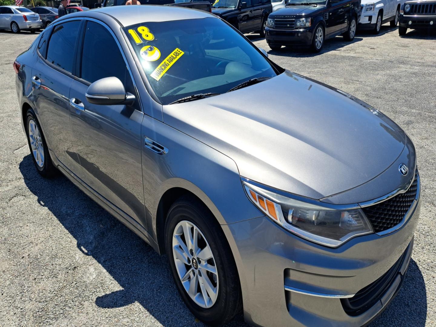 2018 Grey Kia Optima LX (5XXGT4L33JG) with an 2.4L L4 DOHC 16V engine, 6A transmission, located at 1181 Aurora Rd, Melbourne, FL, 32935, (321) 241-1100, 28.132914, -80.639175 - Photo#1